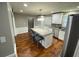 Modern kitchen featuring an island, stainless steel appliances, and hardwood floors at 284 Regal Dr, Lawrenceville, GA 30046