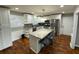Updated kitchen with a granite-topped island, stainless appliances, and counter seating at 284 Regal Dr, Lawrenceville, GA 30046