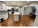 Well-lit kitchen featuring granite countertops, stainless steel appliances, and a central island with bar stool seating at 284 Regal Dr, Lawrenceville, GA 30046