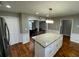 Bright eat-in kitchen featuring granite countertops, white cabinets, and stainless steel appliances at 284 Regal Dr, Lawrenceville, GA 30046