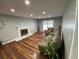 Charming living room featuring hardwood floors and a cozy fireplace, creating a warm and inviting atmosphere at 284 Regal Dr, Lawrenceville, GA 30046