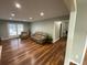 Comfortable living space with beautiful wood floors and a cozy seating arrangement at 284 Regal Dr, Lawrenceville, GA 30046
