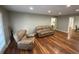 Bright living room with comfortable seating and access to other areas of the house at 284 Regal Dr, Lawrenceville, GA 30046