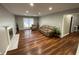Inviting living area with wood floors, a fireplace, and large windows for natural light at 284 Regal Dr, Lawrenceville, GA 30046