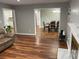 Comfortable living room with hardwood floors seamlessly connecting to the dining area, perfect for entertaining at 284 Regal Dr, Lawrenceville, GA 30046