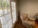 Living room with ample light and hardwood floors, an inviting space for relaxation and entertaining at 284 Regal Dr, Lawrenceville, GA 30046
