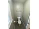 Cozy half bathroom featuring a standard white toilet and neutral wall colors at 284 Regal Dr, Lawrenceville, GA 30046