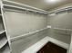 Walk-in closet with shelves and rods for ample storage space at 284 Regal Dr, Lawrenceville, GA 30046