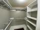 Bright walk-in closet with custom shelving and ample storage space at 284 Regal Dr, Lawrenceville, GA 30046
