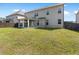 An expansive backyard with healthy lawn featuring a covered outdoor dining area at 3717 Blue Goose Ln, Loganville, GA 30052