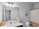 Bright bathroom featuring a vanity and shower at 3717 Blue Goose Ln, Loganville, GA 30052