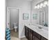 This bathroom features a single vanity, modern lighting, and nautical decor at 3717 Blue Goose Ln, Loganville, GA 30052