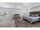 Large bedroom featuring trey ceilings, windows, and carpeted floors at 3717 Blue Goose Ln, Loganville, GA 30052