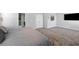 This bedroom features grey walls, plush carpeting, and a large flat-screen television at 3717 Blue Goose Ln, Loganville, GA 30052