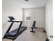 Simple exercise room with treadmill and weight bench at 3717 Blue Goose Ln, Loganville, GA 30052