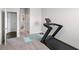 Exercise room featuring treadmill and connecting bathroom at 3717 Blue Goose Ln, Loganville, GA 30052