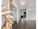 Inviting foyer with wood-look floors, wainscoting, and stylish decor welcoming you into this charming home at 3717 Blue Goose Ln, Loganville, GA 30052