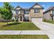 Attractive home with brick and siding, tidy landscaping, and two-car garage at 3717 Blue Goose Ln, Loganville, GA 30052