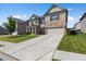 Charming home with brick and siding exterior, well-manicured lawn, and two-car garage at 3717 Blue Goose Ln, Loganville, GA 30052