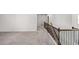 Hallway with wooden railing at 3717 Blue Goose Ln, Loganville, GA 30052