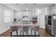 Beautiful kitchen with granite counters, stainless appliances, and a breakfast bar, perfect for casual dining at 3717 Blue Goose Ln, Loganville, GA 30052