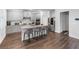 Beautiful kitchen with granite counters, stainless appliances, and a breakfast bar, perfect for casual dining at 3717 Blue Goose Ln, Loganville, GA 30052