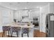 Beautiful kitchen with granite counters, stainless appliances, and a breakfast bar, perfect for casual dining at 3717 Blue Goose Ln, Loganville, GA 30052