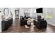 Comfortable living room featuring a fireplace, modern decor, and an open floor plan for easy entertaining at 3717 Blue Goose Ln, Loganville, GA 30052