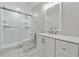 Modern bathroom with walk-in shower and updated vanity at 3753 Eli Dr, Snellville, GA 30039