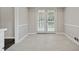 Sunlit dining area with tiled flooring and access to the backyard at 3753 Eli Dr, Snellville, GA 30039