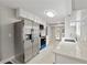 Well-lit kitchen featuring stainless steel appliances and white cabinets at 3753 Eli Dr, Snellville, GA 30039