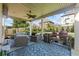 Relaxing covered patio with comfortable seating and cooking area perfect for outdoor entertainment at 3952 Dragon Fly Ln, Loganville, GA 30052
