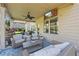 Cozy outdoor back porch with a ceiling fan, comfortable seating and a TV at 3952 Dragon Fly Ln, Loganville, GA 30052