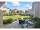 Serene backyard with a cozy fire pit, manicured lawn, and landscaped surroundings at 3952 Dragon Fly Ln, Loganville, GA 30052