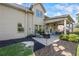 Enjoy outdoor living with a fire pit and covered patio in this home's backyard, perfect for relaxation and entertainment at 3952 Dragon Fly Ln, Loganville, GA 30052