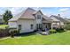 This home boasts a lovely backyard with a covered patio and a cozy fire pit area, perfect for outdoor living at 3952 Dragon Fly Ln, Loganville, GA 30052