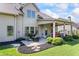 This home's backyard features a charming fire pit area and covered patio, great for entertaining or relaxing outdoors at 3952 Dragon Fly Ln, Loganville, GA 30052