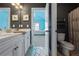 This bathroom features double sinks, neutral walls and floors, and updated fixtures at 3952 Dragon Fly Ln, Loganville, GA 30052