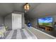 Cozy bedroom with grey walls and neutral carpet, featuring a mounted flatscreen TV at 3952 Dragon Fly Ln, Loganville, GA 30052