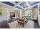 Spacious dining room with dark wood floors, coffered ceiling, and large windows at 3952 Dragon Fly Ln, Loganville, GA 30052