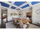 Formal dining room featuring a coffered ceiling, wainscoting, and elegant chandelier at 3952 Dragon Fly Ln, Loganville, GA 30052