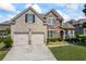 Charming brick and stone home featuring a two-car garage and well-manicured lawn at 3952 Dragon Fly Ln, Loganville, GA 30052