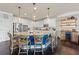 Open-concept kitchen with a large island and bar seating perfect for gatherings at 3952 Dragon Fly Ln, Loganville, GA 30052