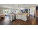 Open-concept kitchen features a central island, stainless steel appliances, and seamless flow into living areas at 3952 Dragon Fly Ln, Loganville, GA 30052