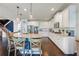 Stylish kitchen with a large island, barstool seating, stainless steel appliances, and abundant cabinet space at 3952 Dragon Fly Ln, Loganville, GA 30052