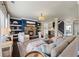Elegant living room with a stone fireplace, custom built-ins, and a comfortable layout for gatherings at 3952 Dragon Fly Ln, Loganville, GA 30052