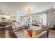 Spacious living room showcasing an open floor plan, abundant natural light, and stylish furnishings for entertaining at 3952 Dragon Fly Ln, Loganville, GA 30052