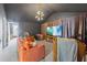 Finished upper level with high ceiling, comfortable seating, and an entertainment area at 3952 Dragon Fly Ln, Loganville, GA 30052