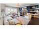 Inviting living room featuring a cozy fireplace, built-in shelving, and comfortable seating, perfect for relaxation at 3952 Dragon Fly Ln, Loganville, GA 30052