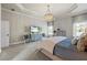 Spacious main bedroom with tray ceilings, plush carpet, and a cozy sitting area at 3952 Dragon Fly Ln, Loganville, GA 30052